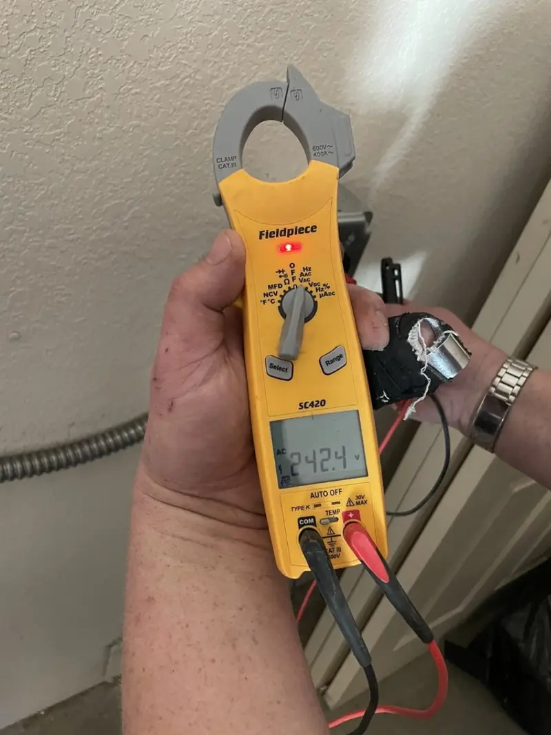Voltage testing with clamp meter during Circuit Breaker Repair in Auburn